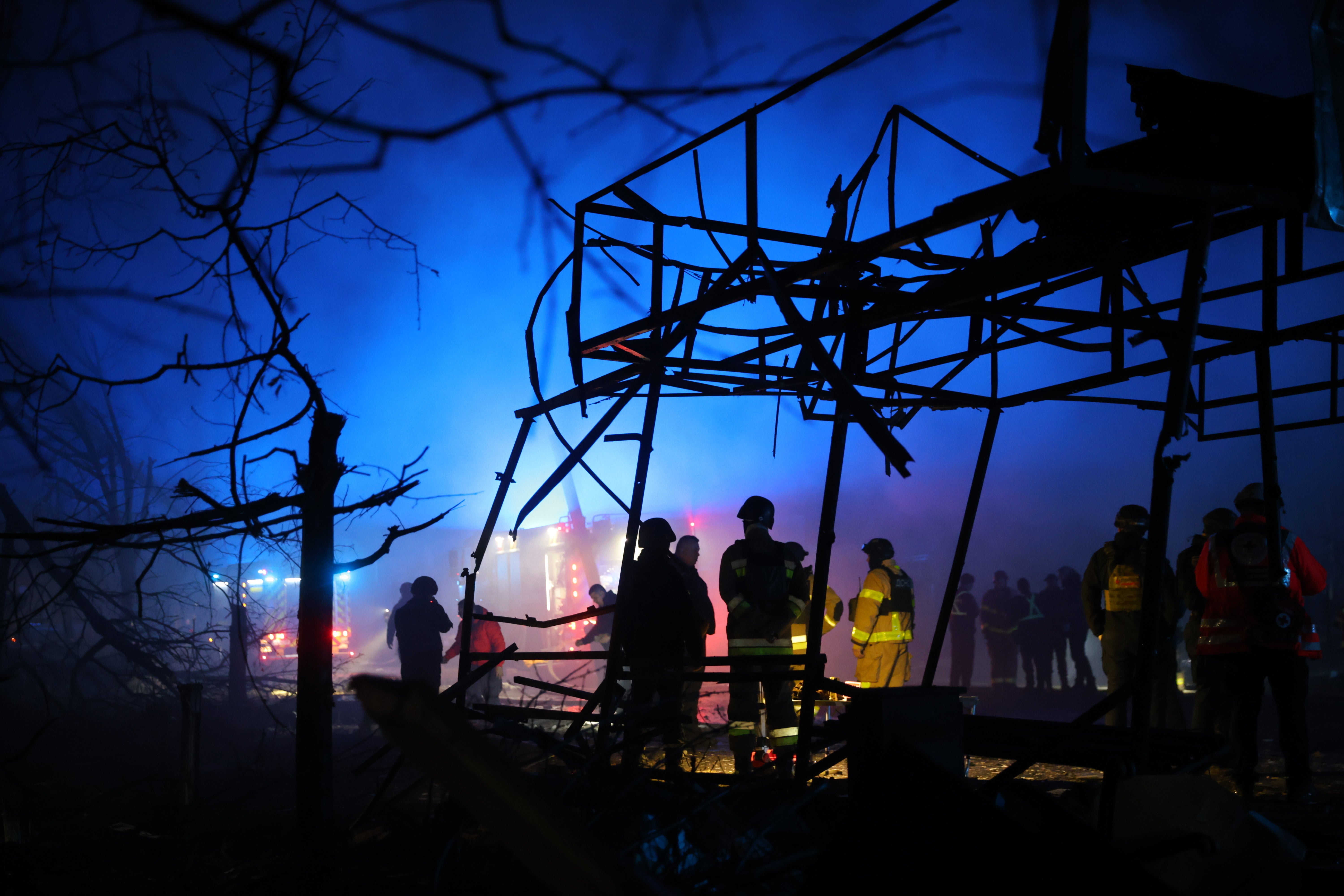 APTOPIX Russia Ukraine WRescues work at a market destroyed by a Russian airstrike on Zaporizhzhia, Ukraine, Friday, Nov. 21, 2025. (AP Photo/Kateryna Klochko)