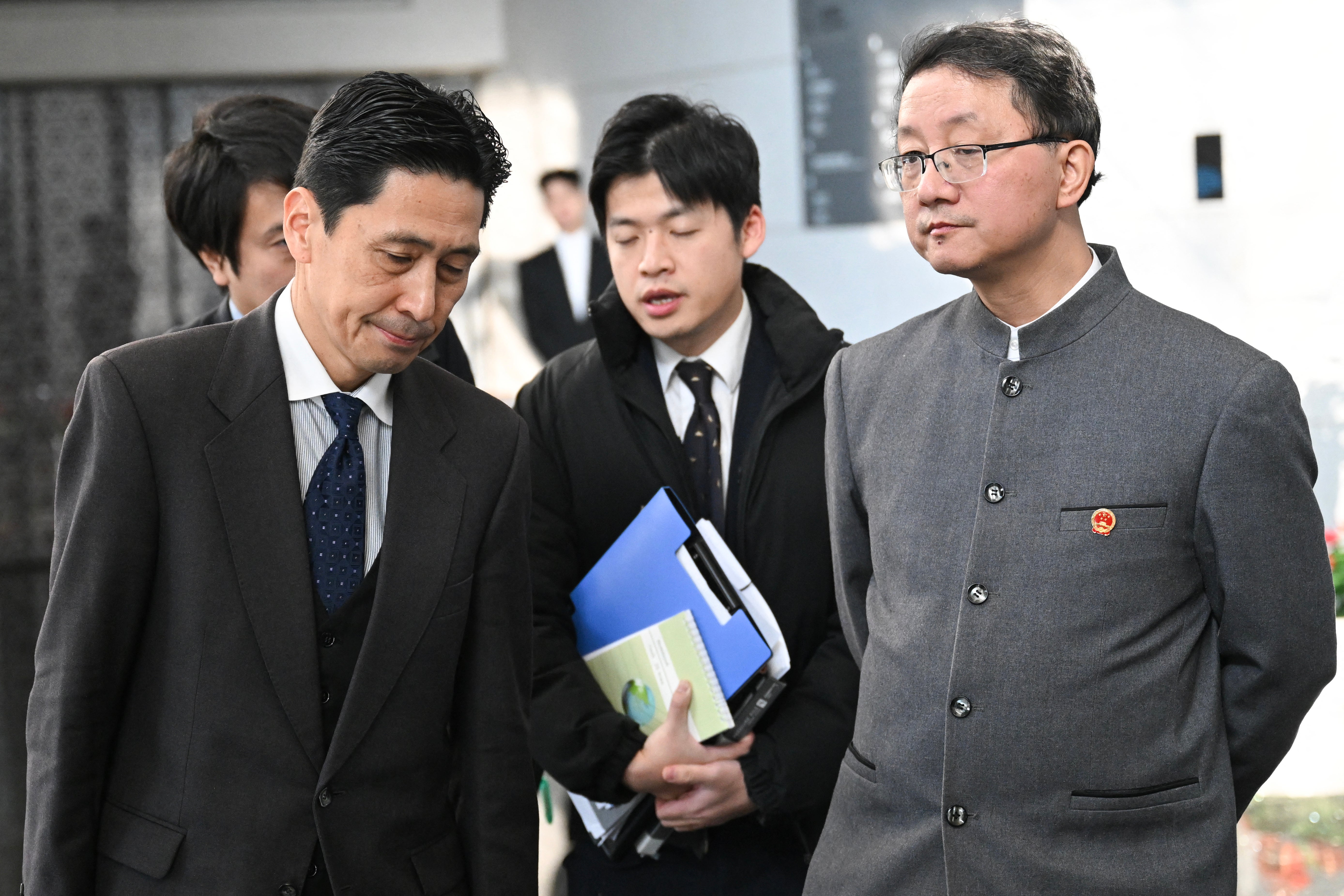 <p>Japanese Director-General of the Foreign Ministry's Asian and Oceanian Affairs Bureau Masaaki Kanai (L) and Chinese Director-General of the Department of Asian Affairs Liu Jinsong (C) depart after a meeting at the Foreign Ministry in Beijing on November 18, 2025 </p>