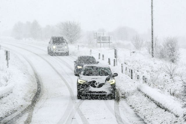 Snow and ice caused disruption on the roads and forced the closure of hundreds of schools in parts of the UK (Danny Lawson/PA)