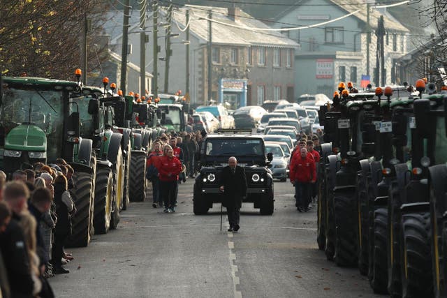 Members of Drumconrath GFC walked alongside the funeral cortege for Alan McCluskey at Peter and Paul’s Church, Drumconrath (PA)