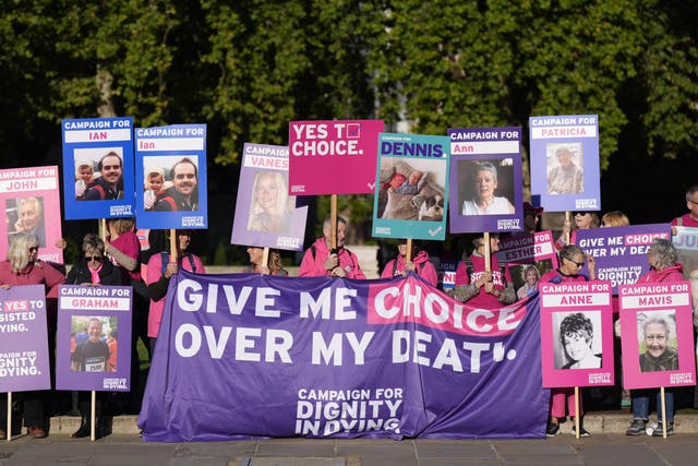 Pro-assisted dying campaigners outside the Houses of Parliament (Aaron Chown/PA)