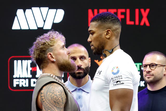 <p>Jake Paul (left) staring up at next opponent Anthony Joshua</p>