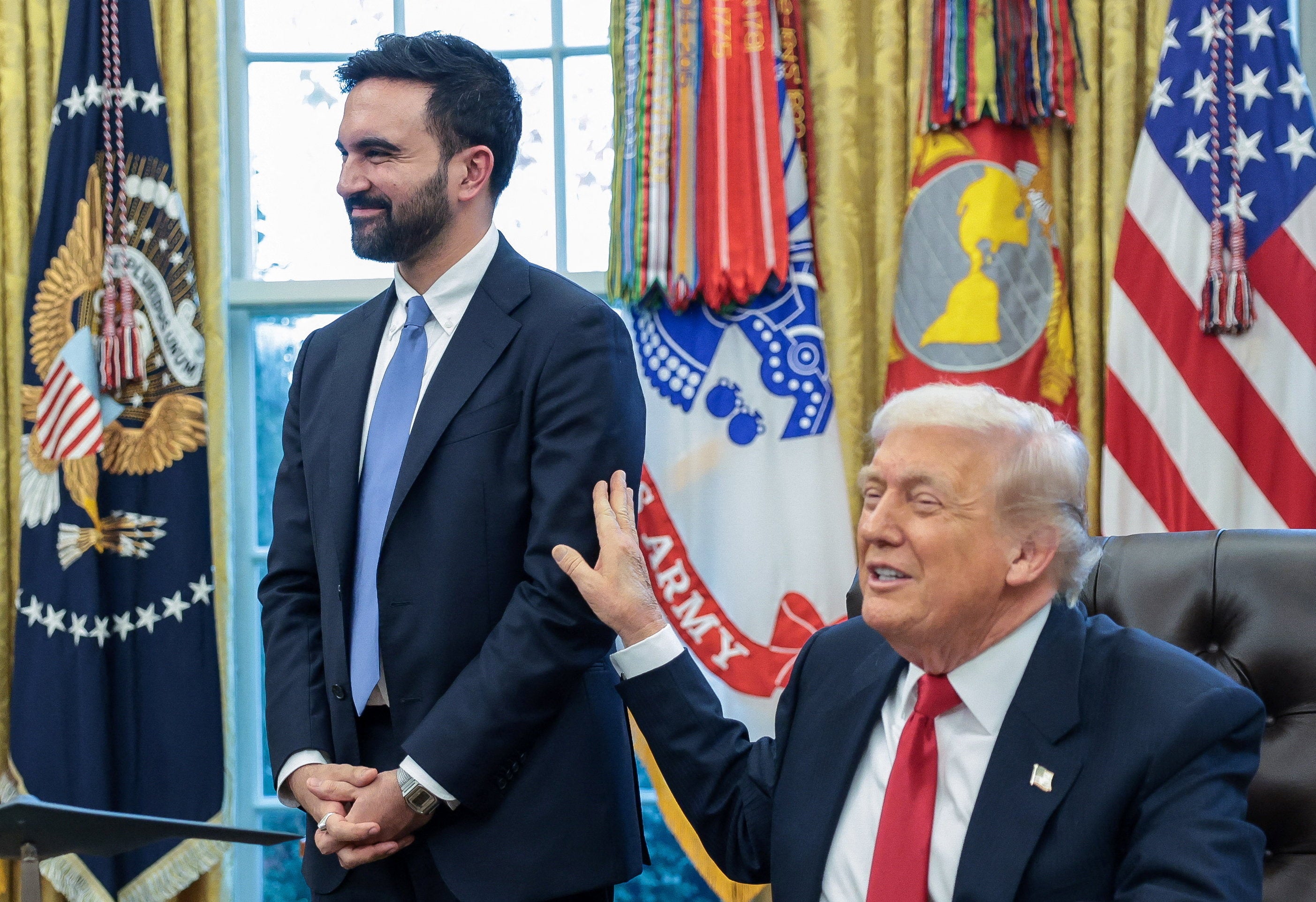 <p>U.S. President Donald Trump and New York City Mayor-elect Zohran Mamdani speak to members of the media as they meet in the Oval Office at the White House in Washington, D.C., U.S., November 21, 2025. REUTERS/Jonathan Ernst</p>