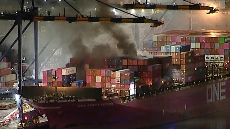 Container Battle Dozens of firefighters battle blaze on container ship docked at LA port ...