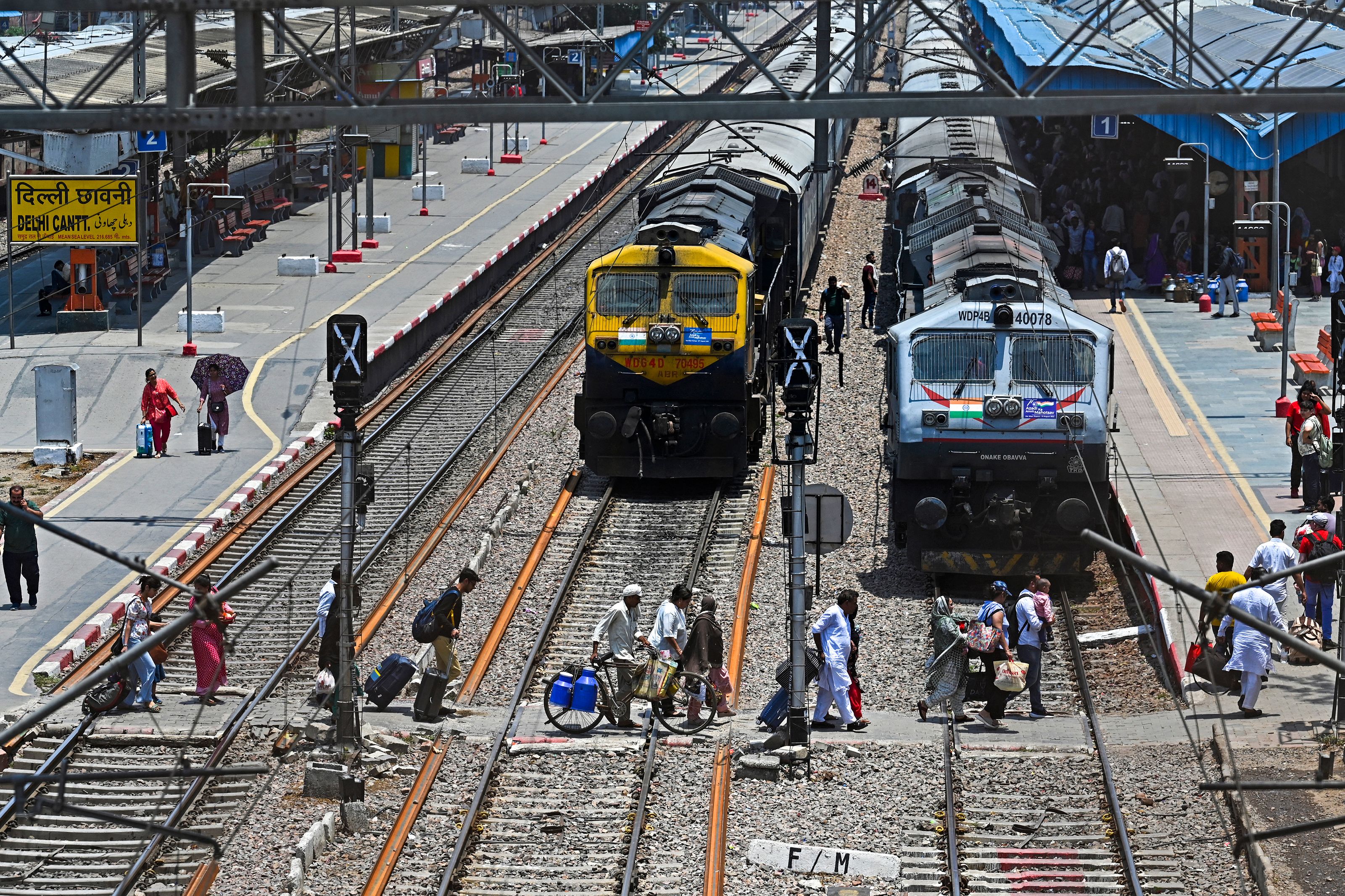 <p>File. Representative. Vande Bharat Express train’s passengers cross railway tracks upon their arrival at the Delhi Cantt station in New Delhi on 5 June 2023</p>