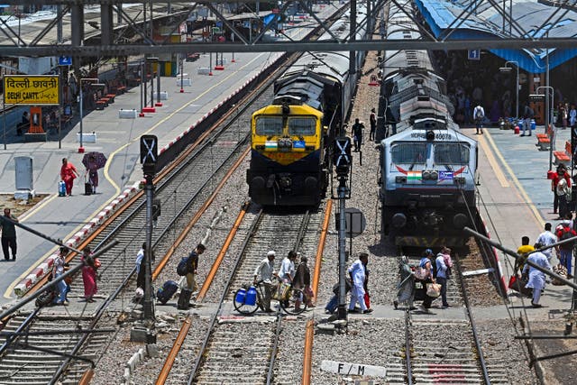 <p>File. Representative. Vande Bharat Express train’s passengers cross railway tracks upon their arrival at the Delhi Cantt station in New Delhi on 5 June 2023</p>