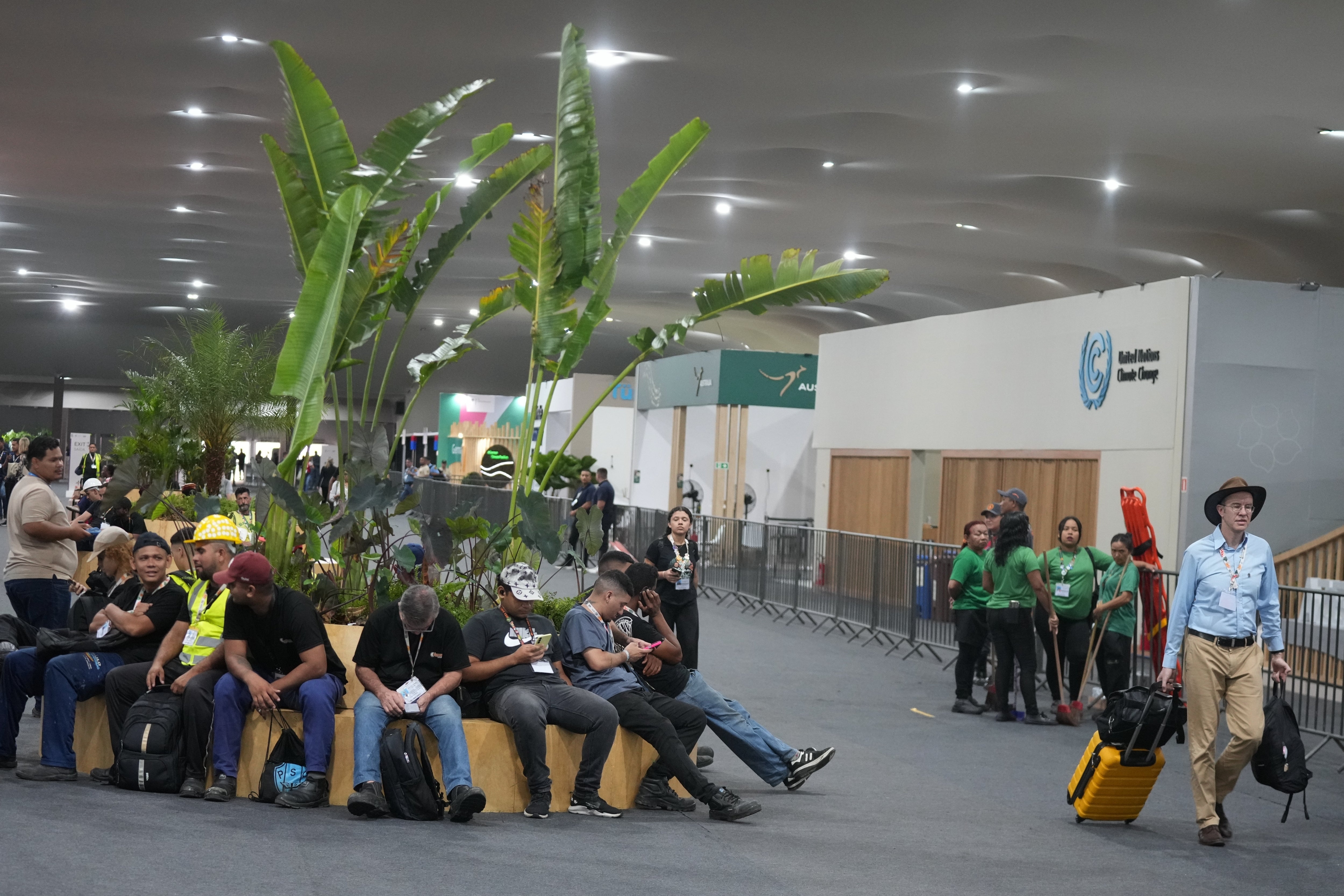 An attendee of Cop30 arrived at the conference hall with his luggage as negotiations continued on Saturday