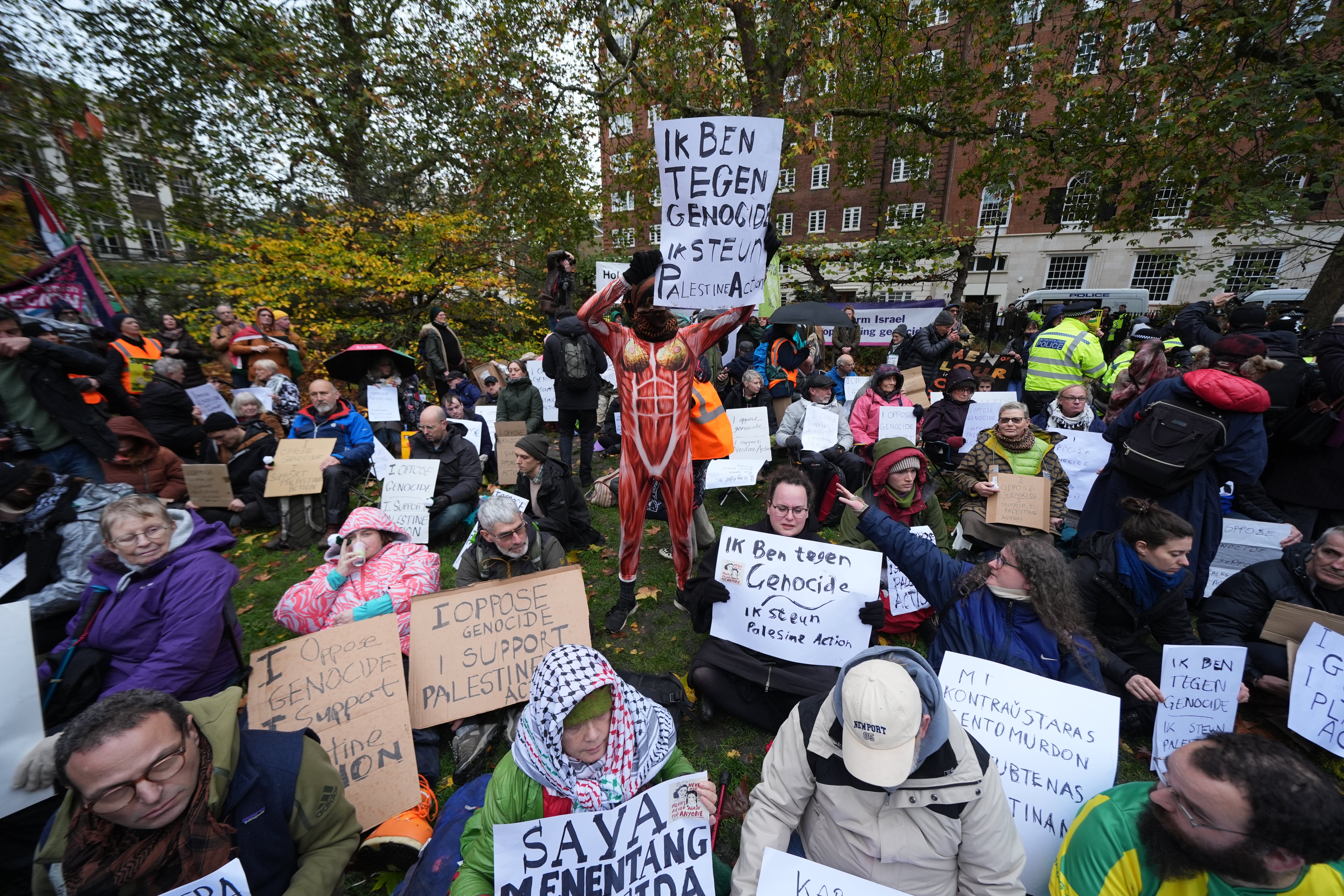 Campaigners at the Defend Our Juries protest in support of Palestine Action at The Peace Garden, Tavistock Square, central London (Lucy North/PA)