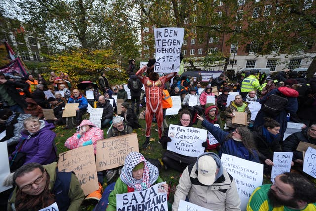 <p>Campaigners at the Defend Our Juries protest in support of Palestine Action at The Peace Garden, Tavistock Square, central London (Lucy North/PA)</p>