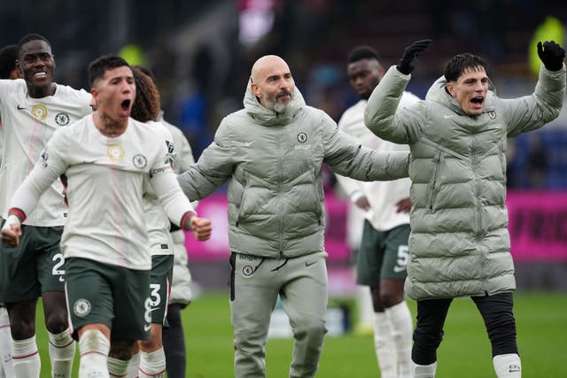 Enzo Maresca, centre, celebrates Chelsea’s win over Burnley with his players (Martin Rickett/PA)
