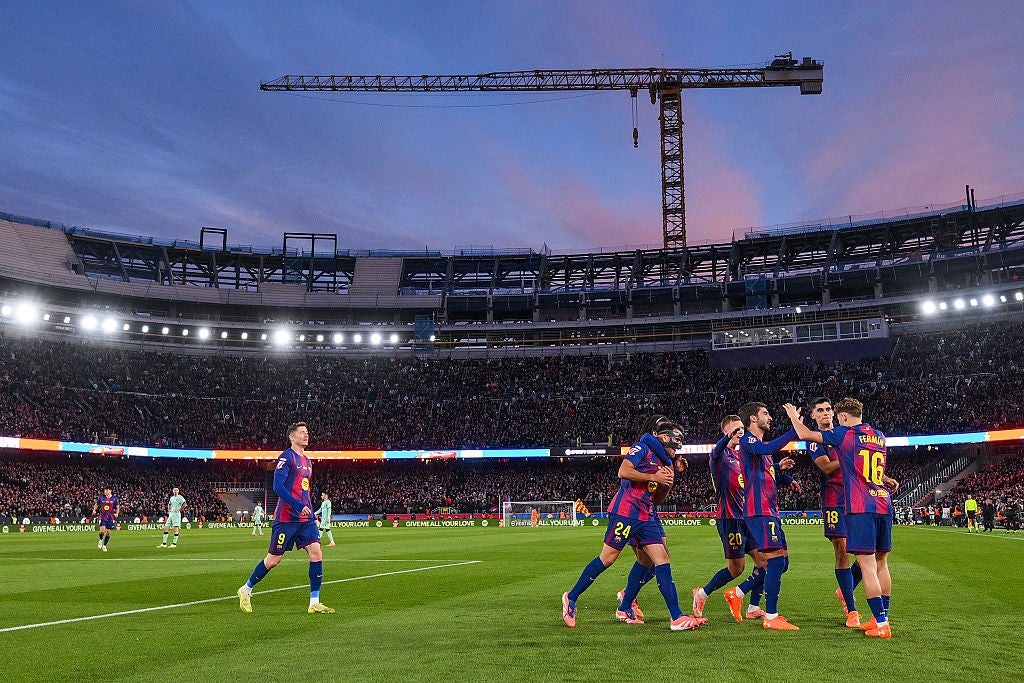 Barcelona celebrate on their return to the partially-opened Camp Nou