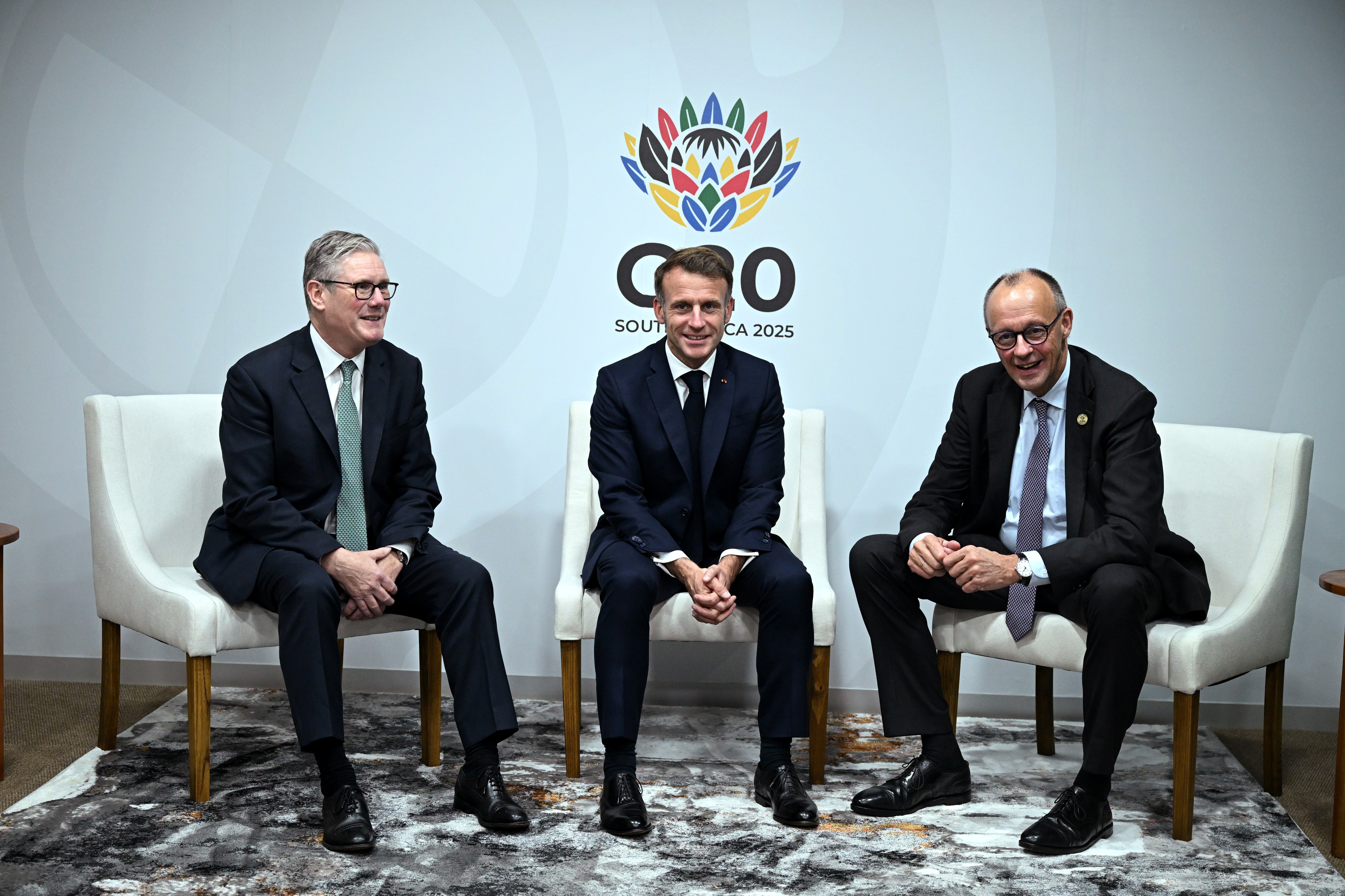 Sir Keir Starmer, Emmanuel Macron and German Chancellor Friedrich Merz during the G20 summit in South Africa on November 22