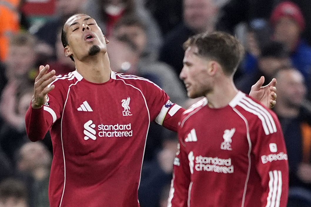 Liverpool’s Virgil van Dijk (left) wants more from his team-mates (PA)