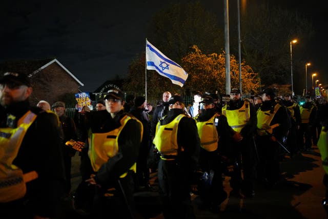 Pro-Israel supporters are led away from Villa Park, home of Aston Villa by police officers, before the match earlier this month (PA)