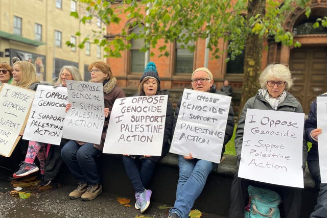 Campaigners take part a Defend Our Juries protest in support of Palestine Action in Belfast (PA)