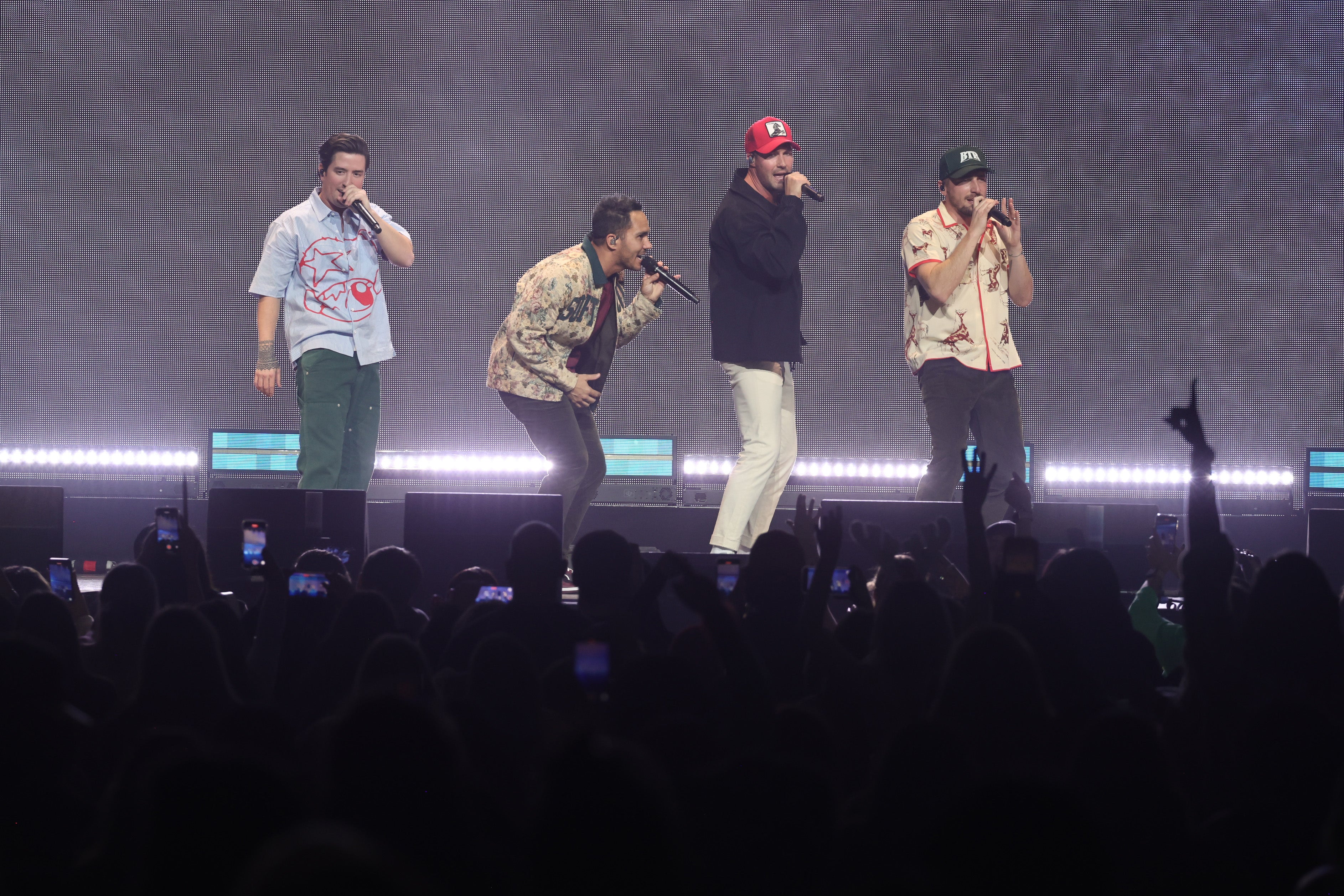(L-R) Logan Henderson, Carlos PenaVega, James Maslow and Kendall Schmidt of Big Time Rush performing at iHeart Radio's Jungle Ball 2023