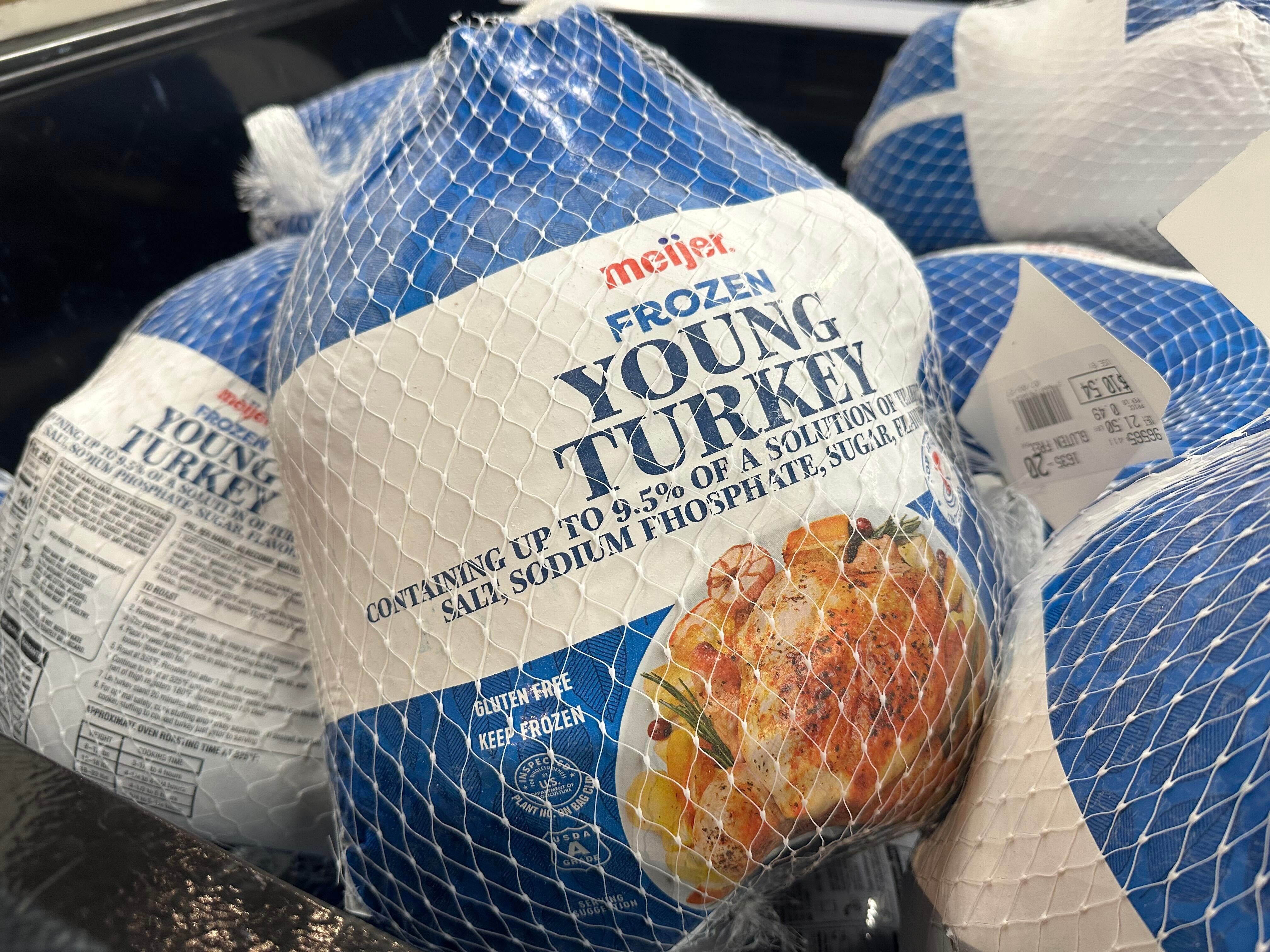 Frozen turkeys are on display at a Meijer in the last week before Thanksgiving