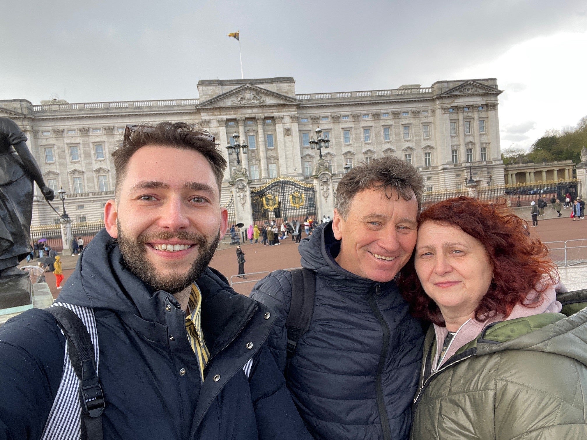 Pawel taking a selfie with his parents