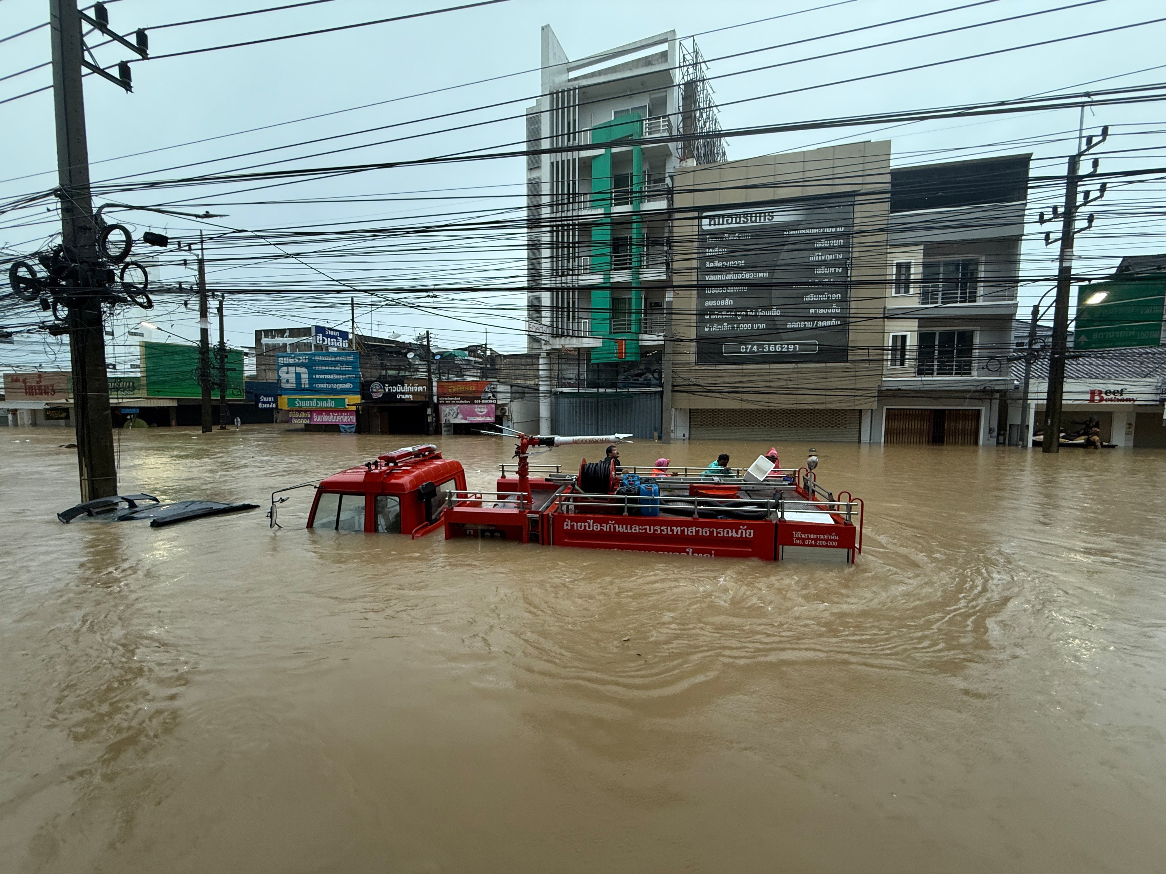 A fire truck is submerged in floodwaters in Songkhla province, southern Thailand, Monday, Nov. 24
