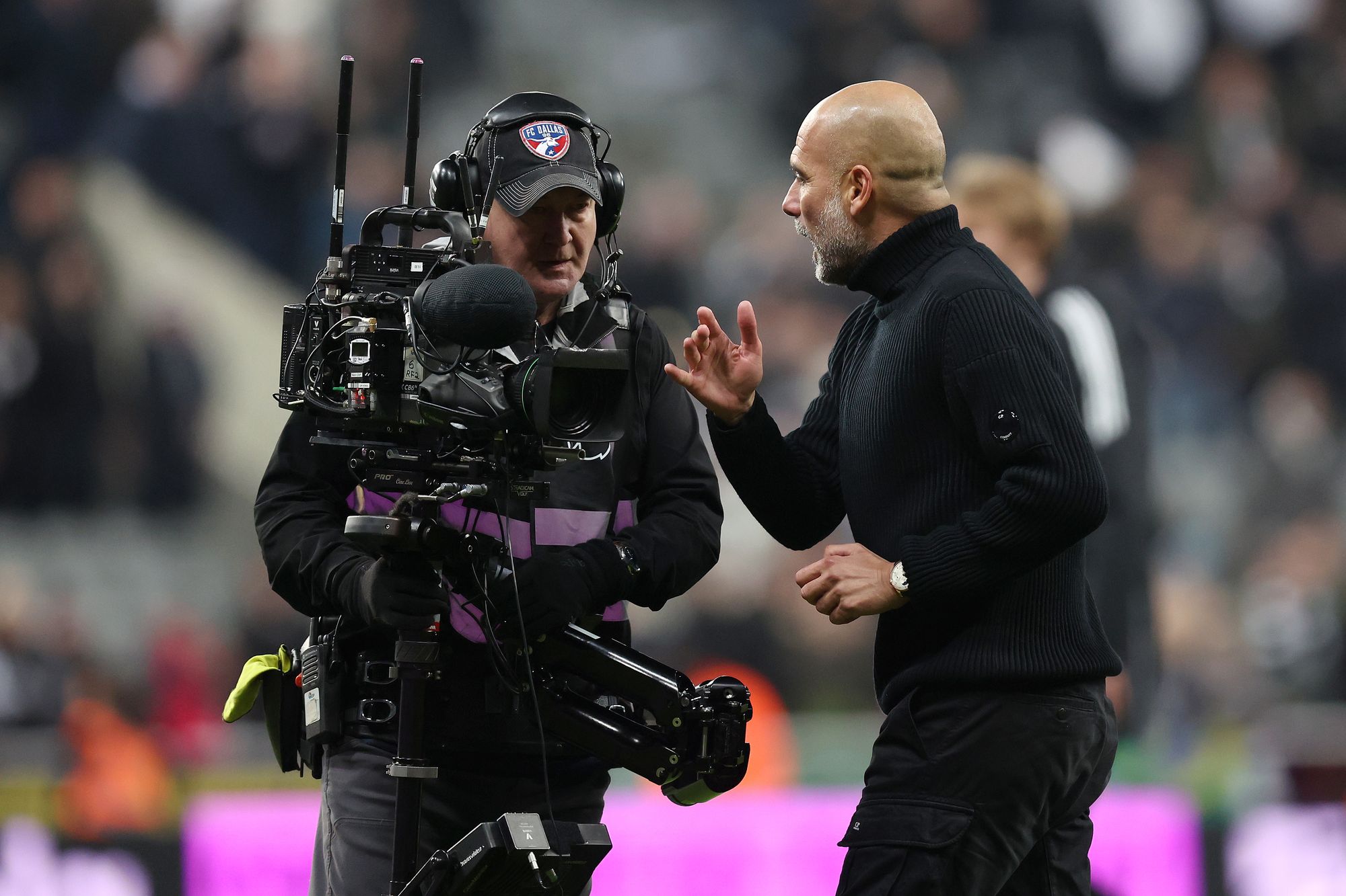 Pep Guardiola has apologised for confronting a cameraman
