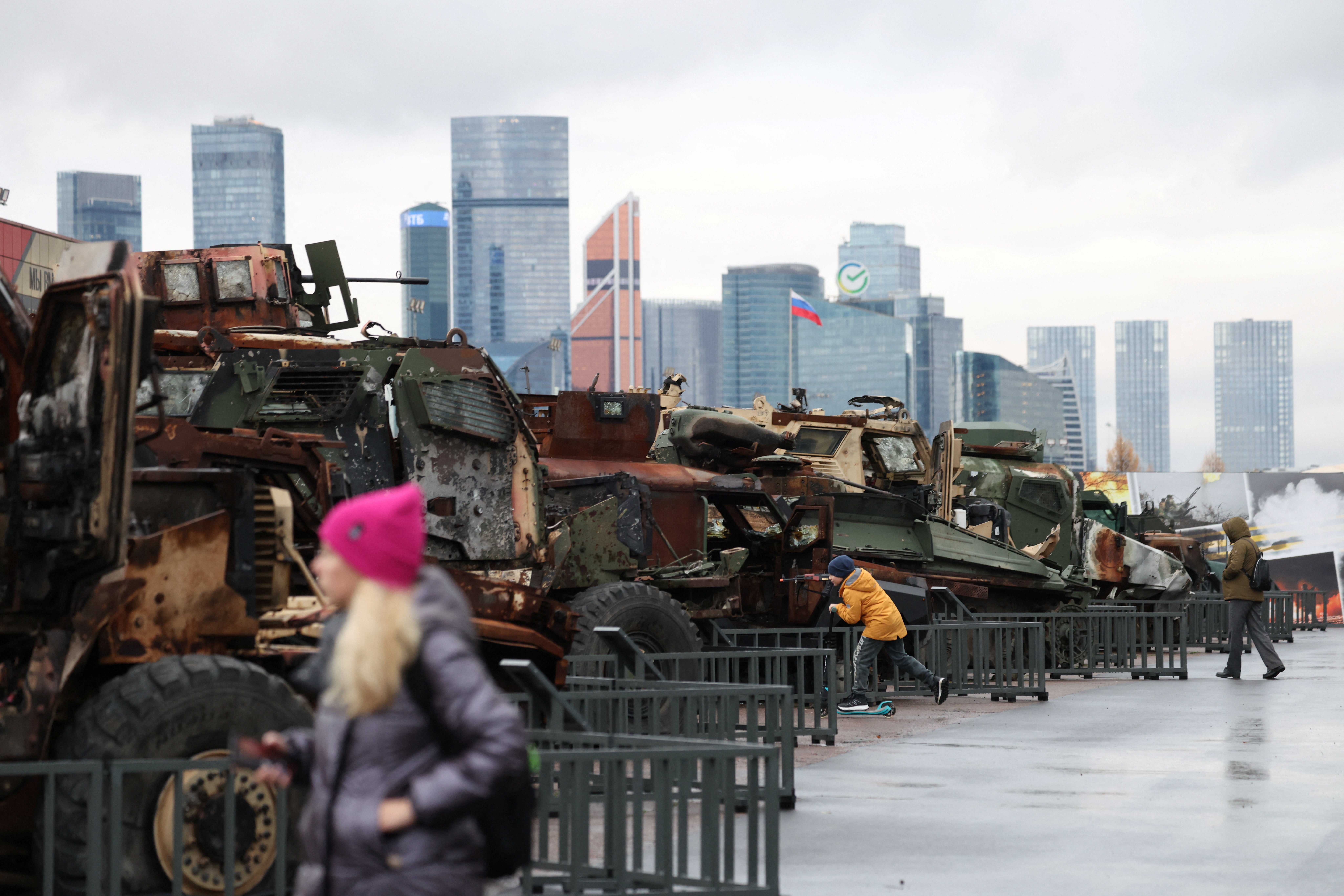 People visit an exhibition of military hardware and equipment, said to have been destroyed and captured by Russian armed forces in the course of a conflict against Ukraine