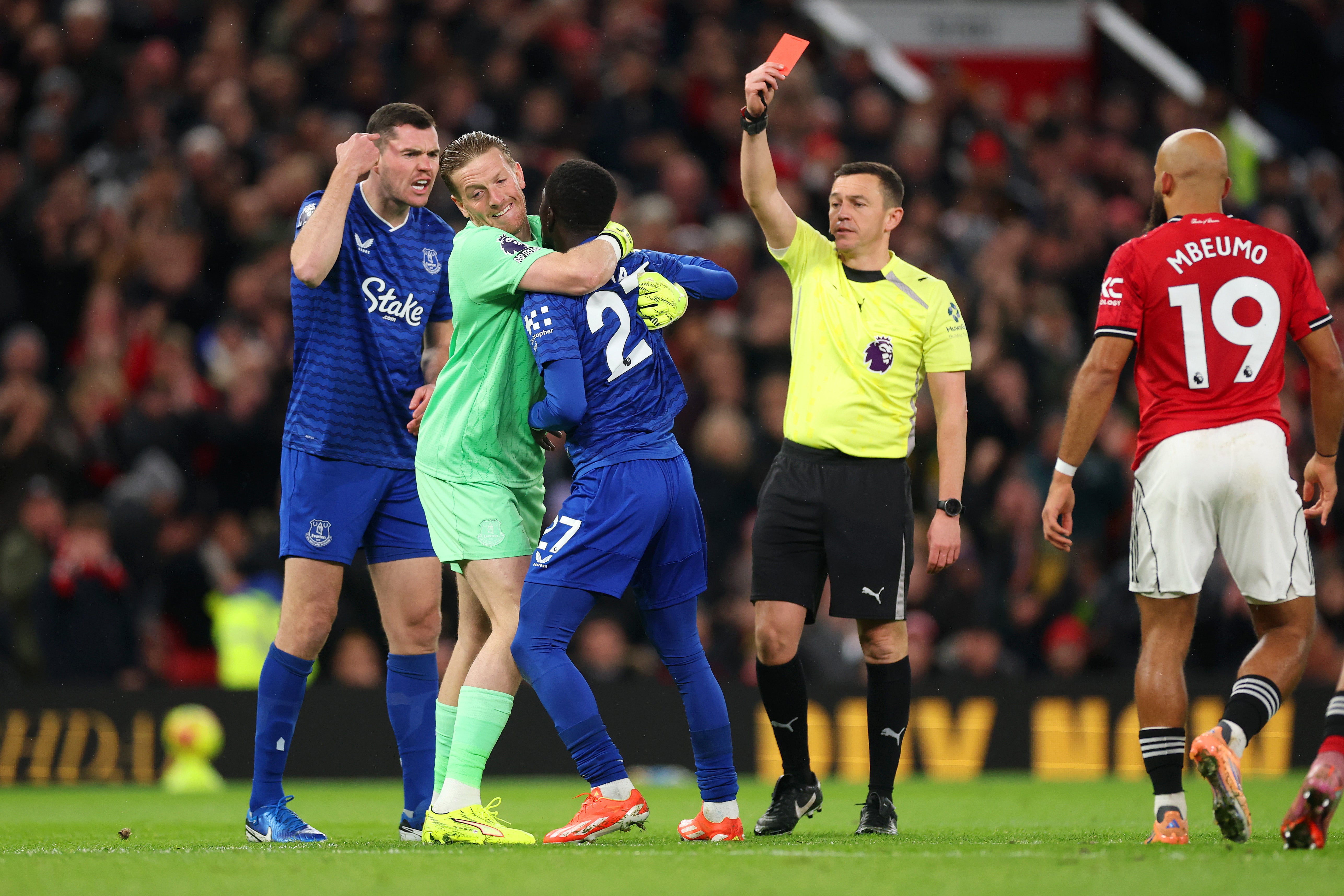 <p>Everton's Idrissa Gueye is held back by Jordan Pickford after a confrontation with team-mate Michael Keane</p>