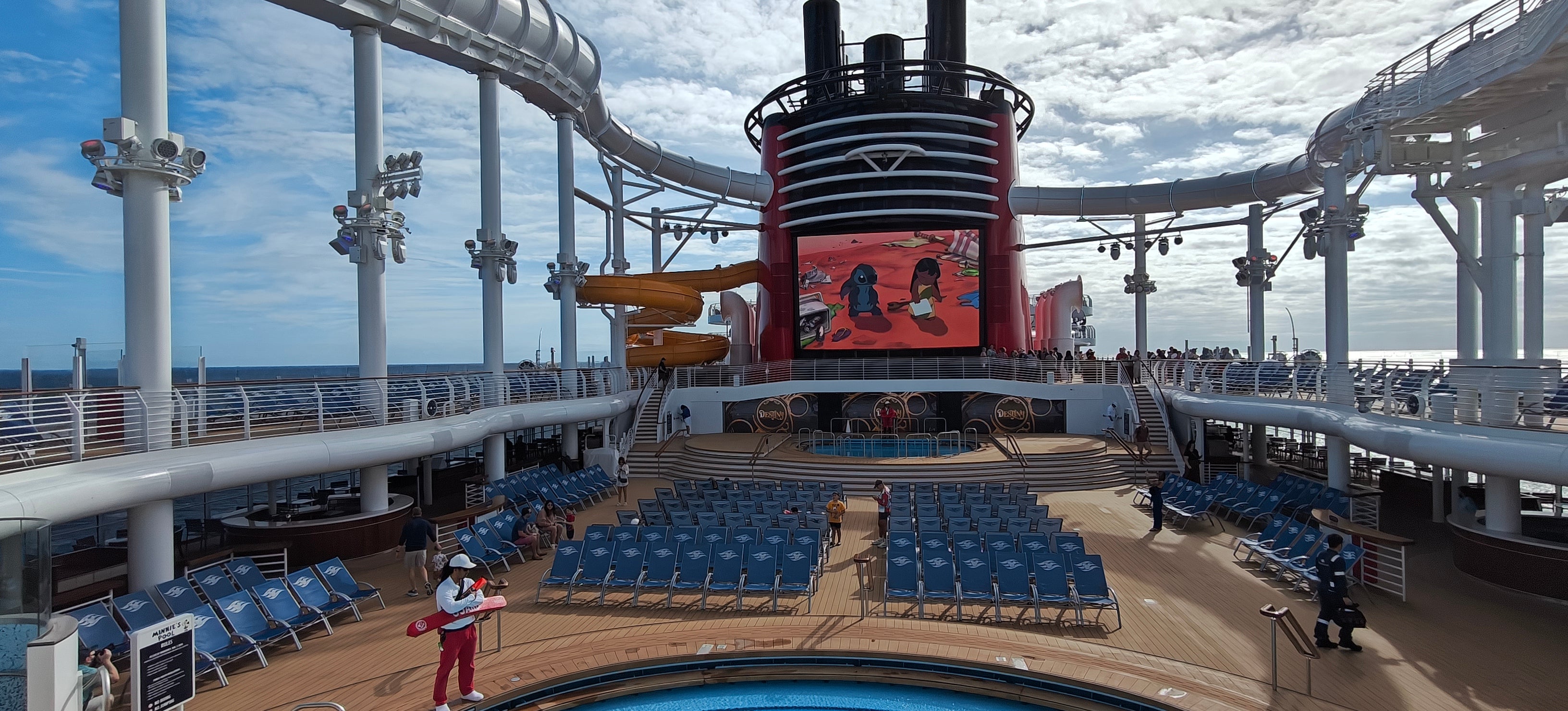 The Aqua Mouse ride transports guests around the ship and over the sea in a white tube