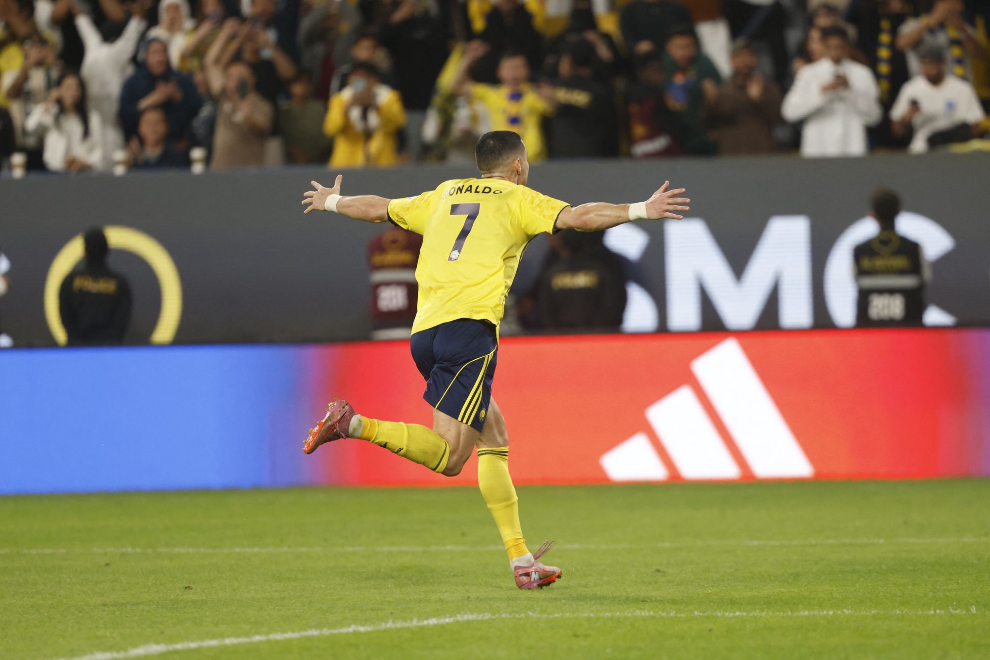 Cristiano Ronaldo wheels away in celebration after scoring a bicycle kick