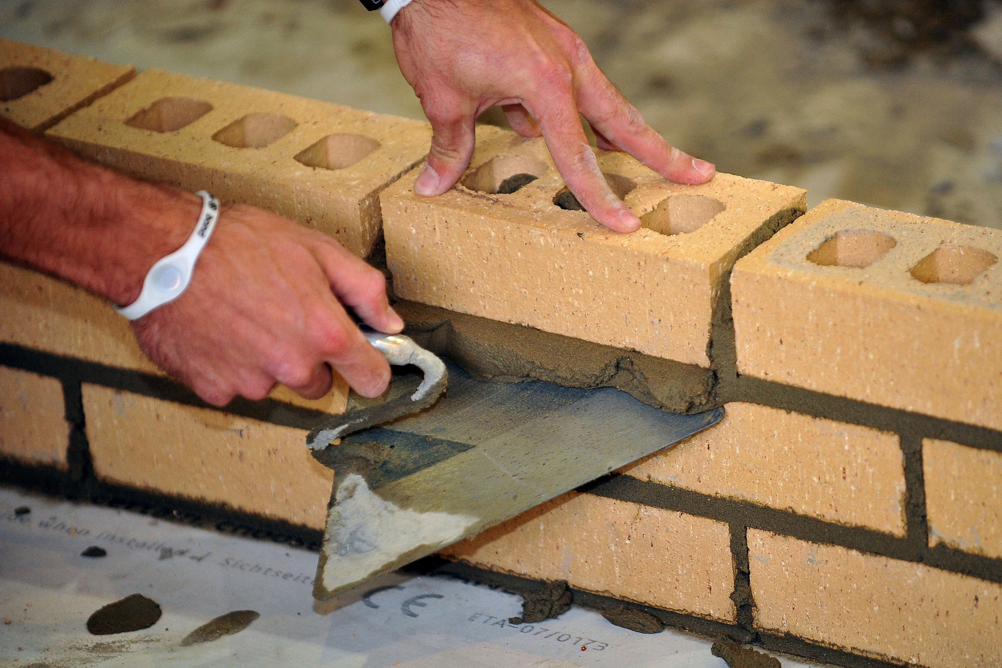 A trainee bricklayer at work (Ian Nicholson/PA)