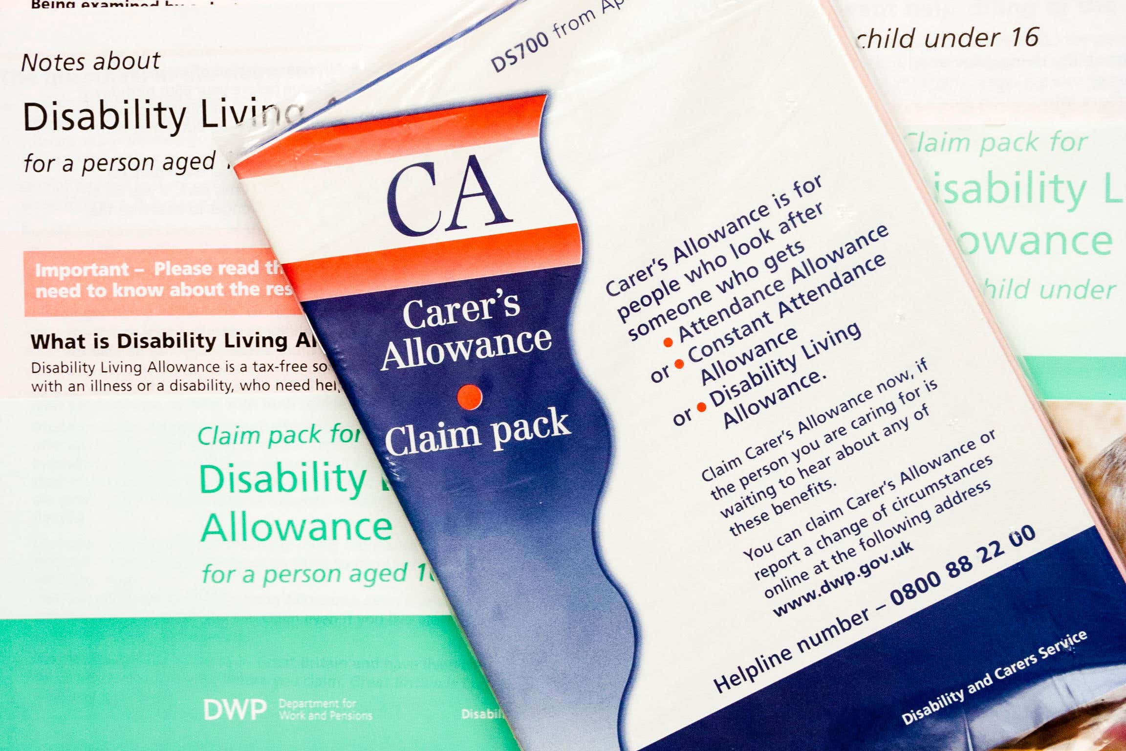 Many carers unwittingly built up huge debt after being overpaid carer’s allowance, a review said (Alamy/PA)