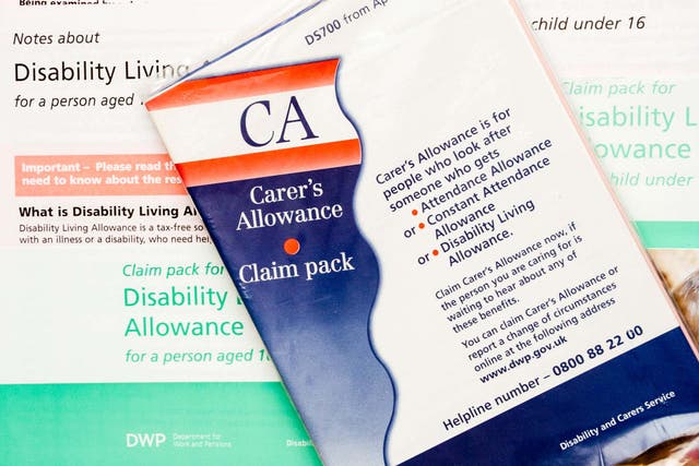 Many carers unwittingly built up huge debt after being overpaid carer’s allowance, a review said (Alamy/PA)