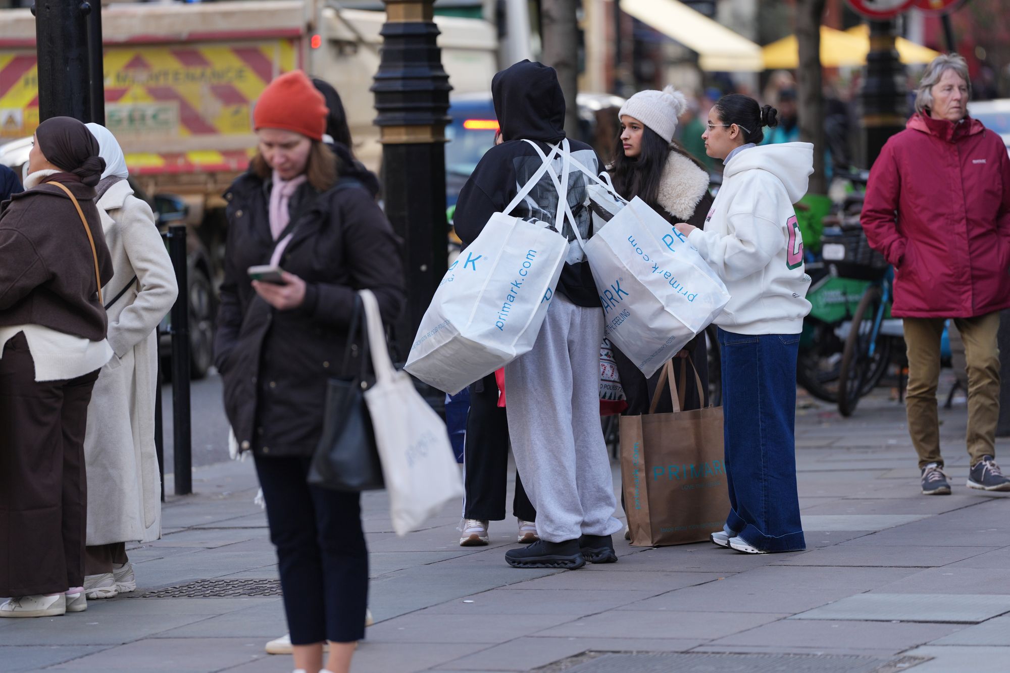 Shoppers carrying bags after Black Friday
