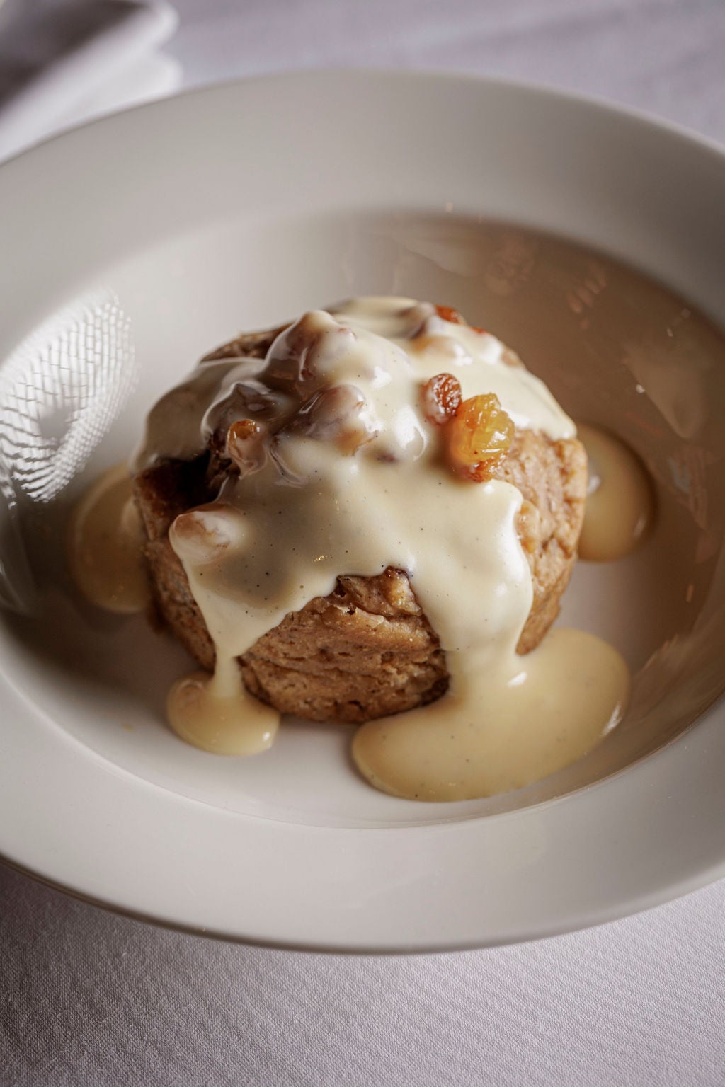 A timeless British classic, made even better drowned in warm custard and a little extra rum-soaked fruit