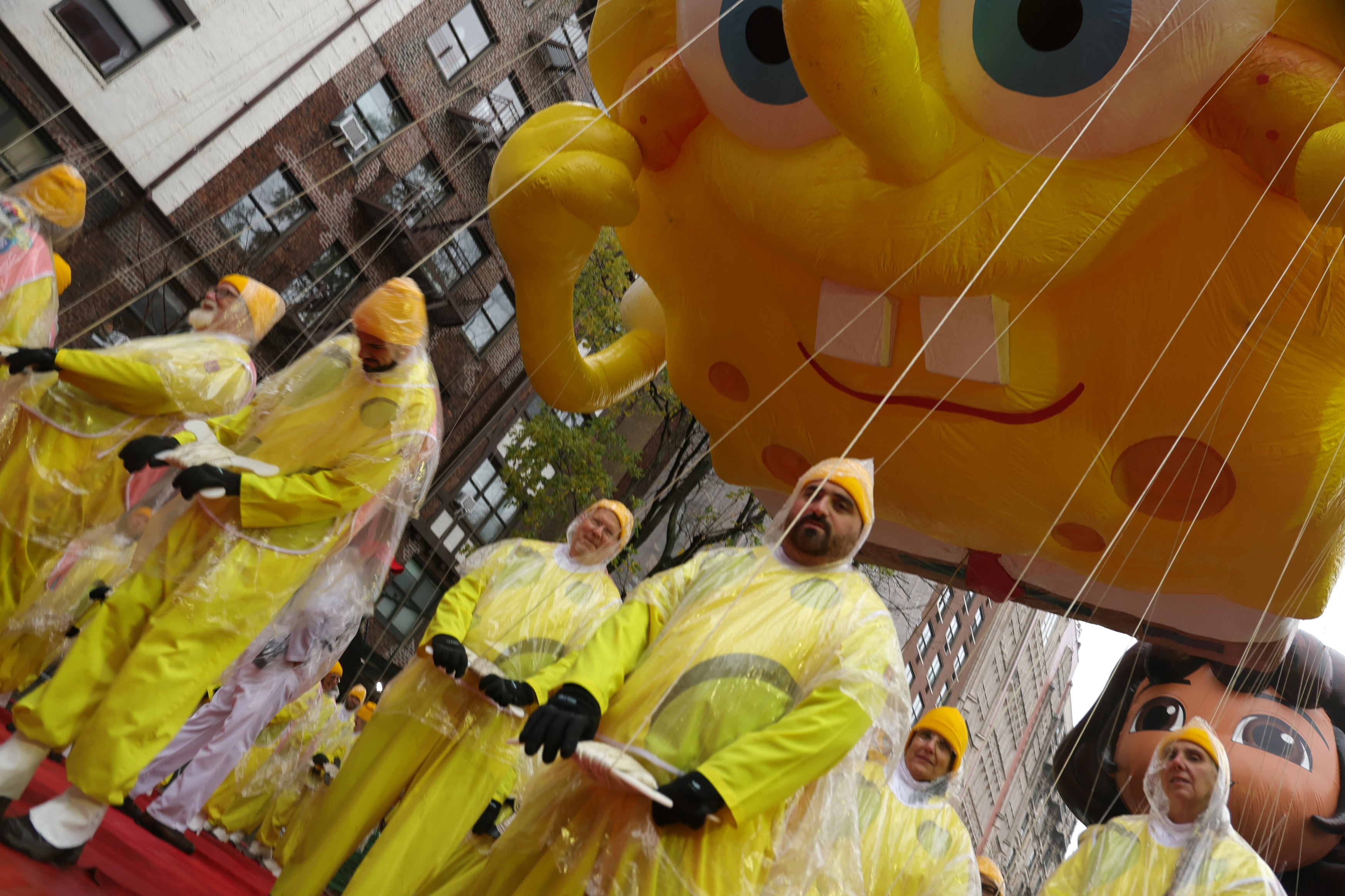 Parade participants are seen with the SpongeBob SquarePants & Gary Balloon during the 2024 Macy's Thanksgiving Day Parade on November 28, 2024 in New York City