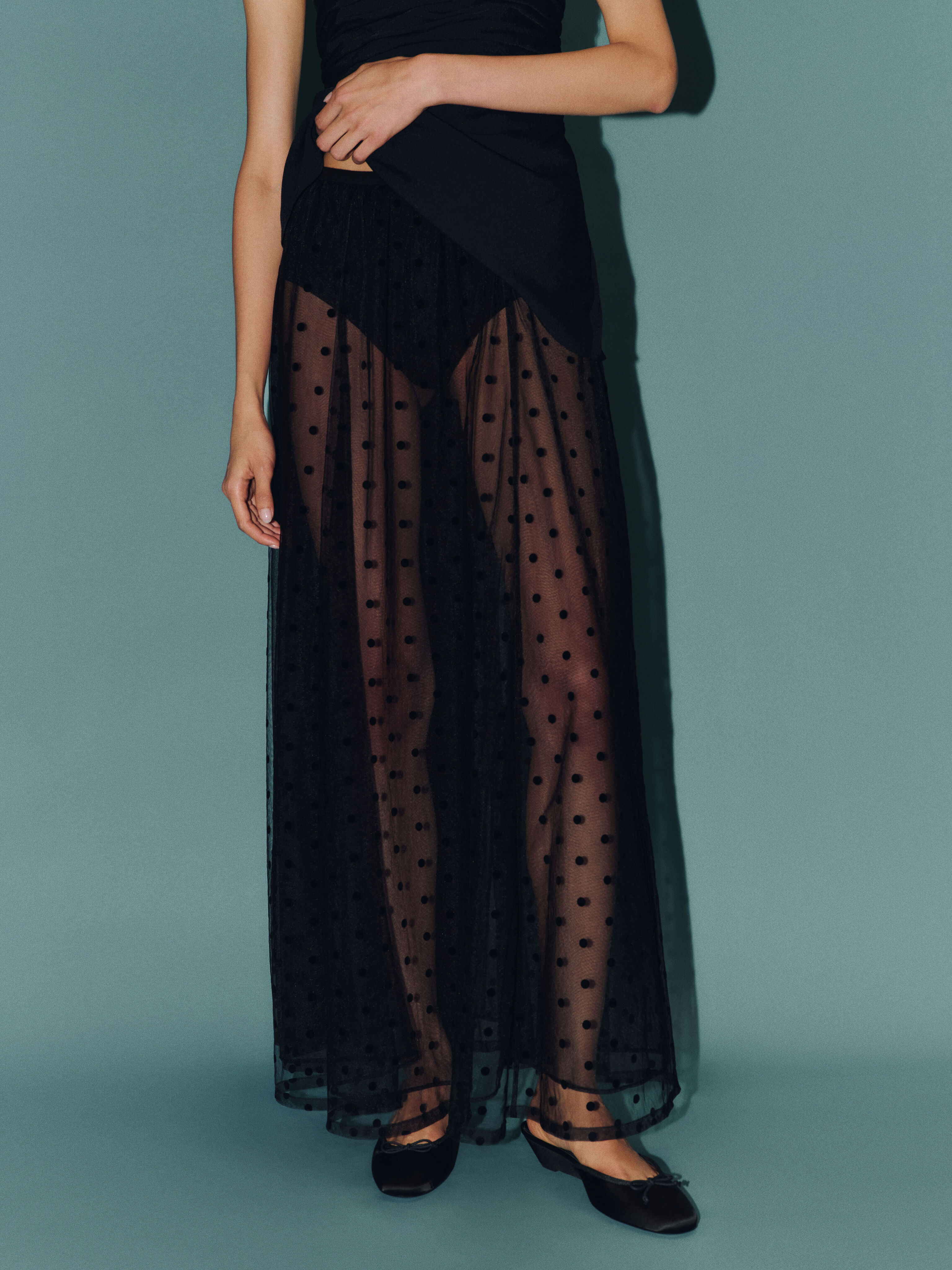 Reformation has plenty of statement skirts this season, including this mesh polka dot option