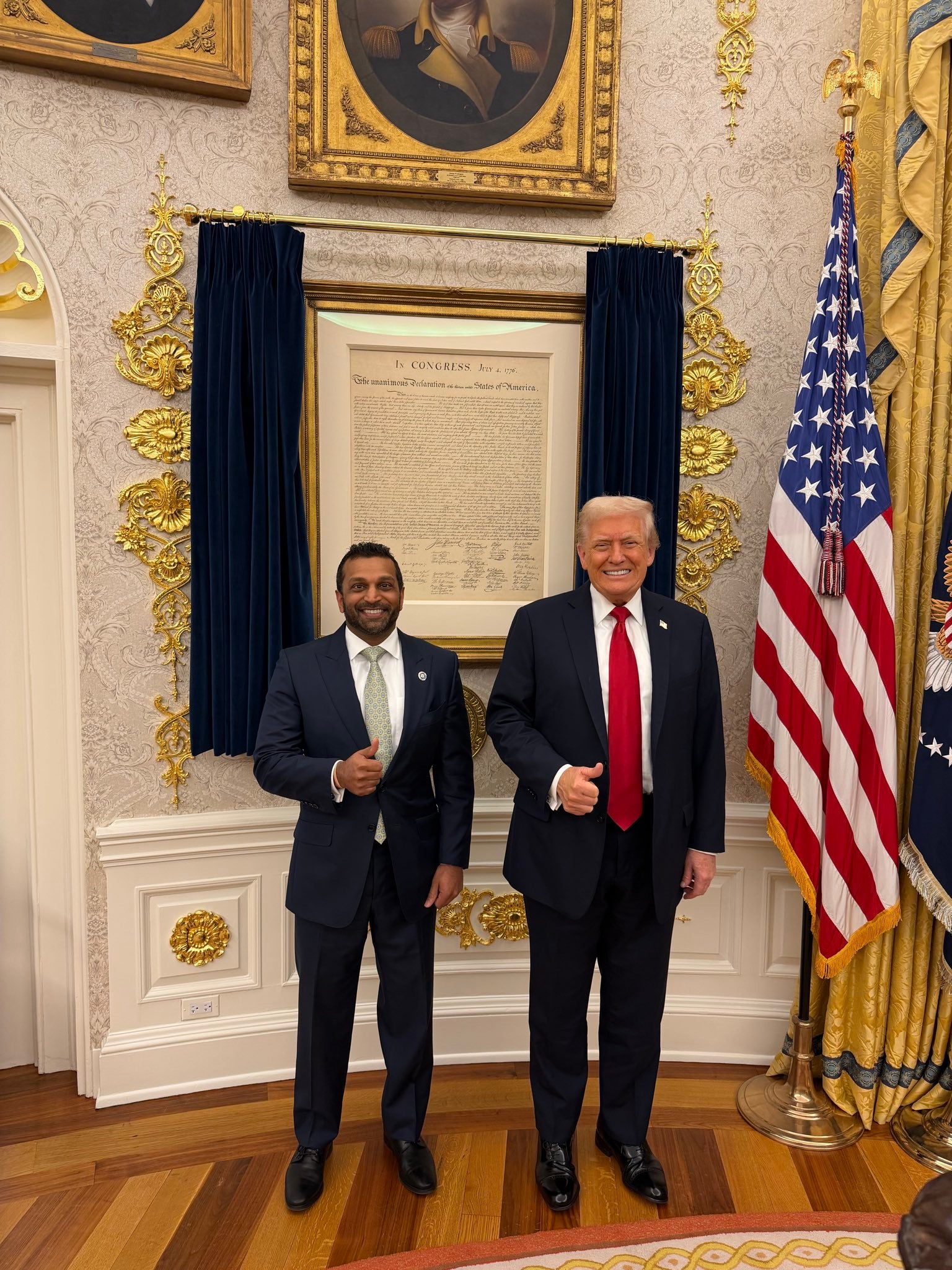 Trump and Patel posed for a photo in front of a framed copy of the Declaration of Independence following a report that claimed the president was on the verge of firing the FBI director.