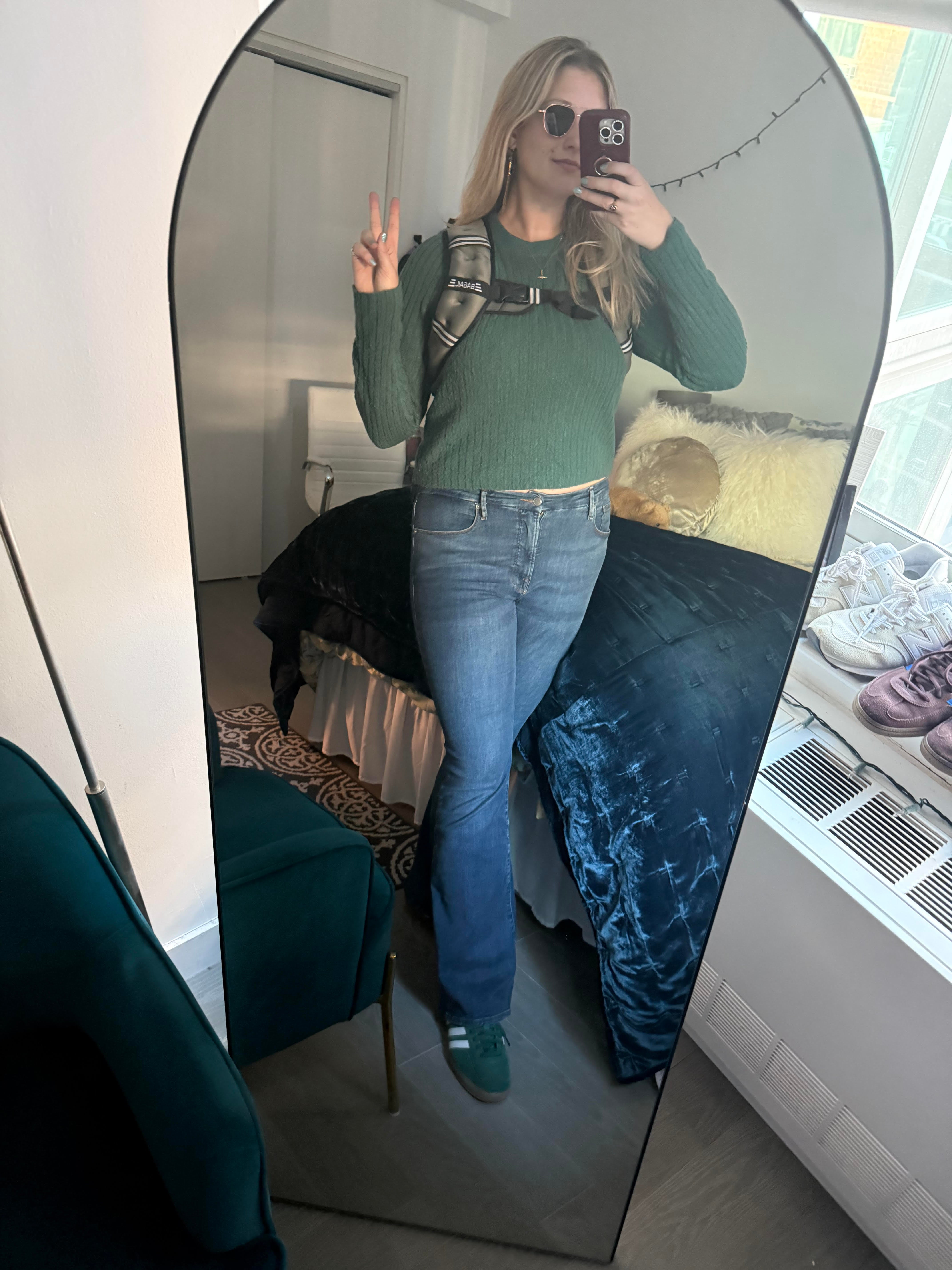 Musto tries on her weighted vest for the first time at her apartment in New York City in October 2025