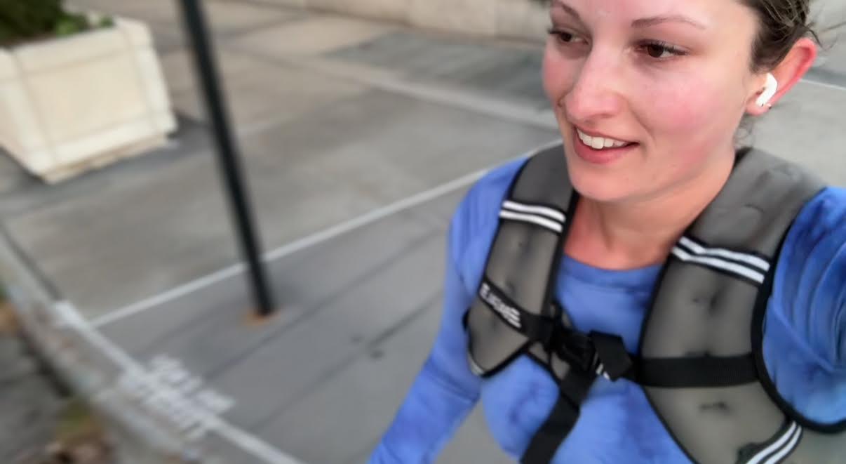 Musto runs down Riverside Drive in Manhattan wearing a weighted vest