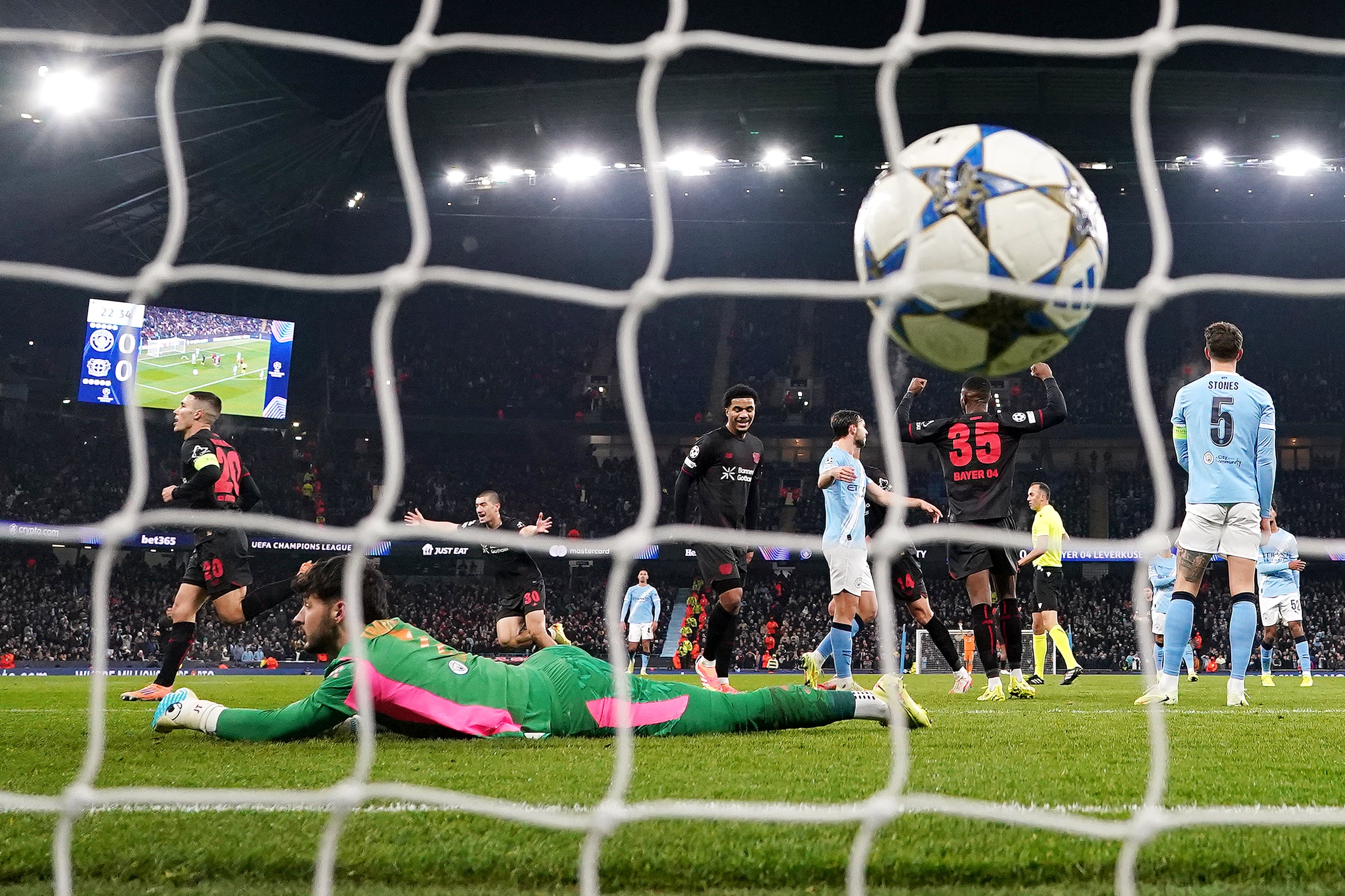 Alejandro Grimaldo (left) celebrates scoring past James Trafford (Martin Rickett/PA)