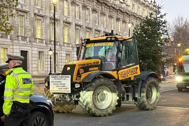 A tractor arrives for the protest by farmers in Whitehall ahead of Rachel Reeves’ Budget statement (Harriet Tolson/PA)