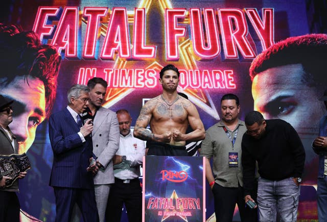 <p>Eddie Hearn (second-left) looks on as Ryan Garcia makes weight</p>
