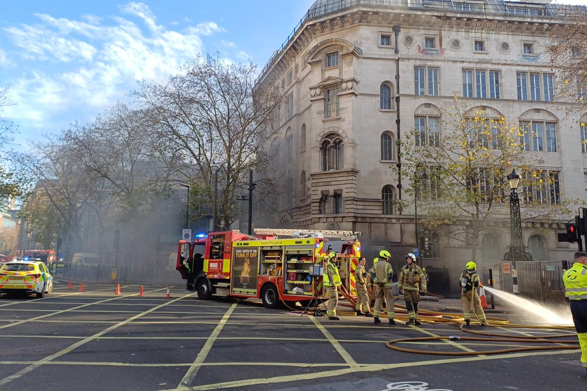 Dozens of firefighters tackle underground fire in central London