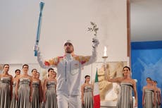 Winter Olympics torch lighting ceremony moved to museum amid bad weather
