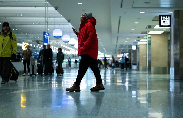 <p>Travelers pass through Minneapolis-Saint Paul International Airport Wednesday. This Thanksgiving is expected to be the busiest for flying in nearly 15 years.</p>