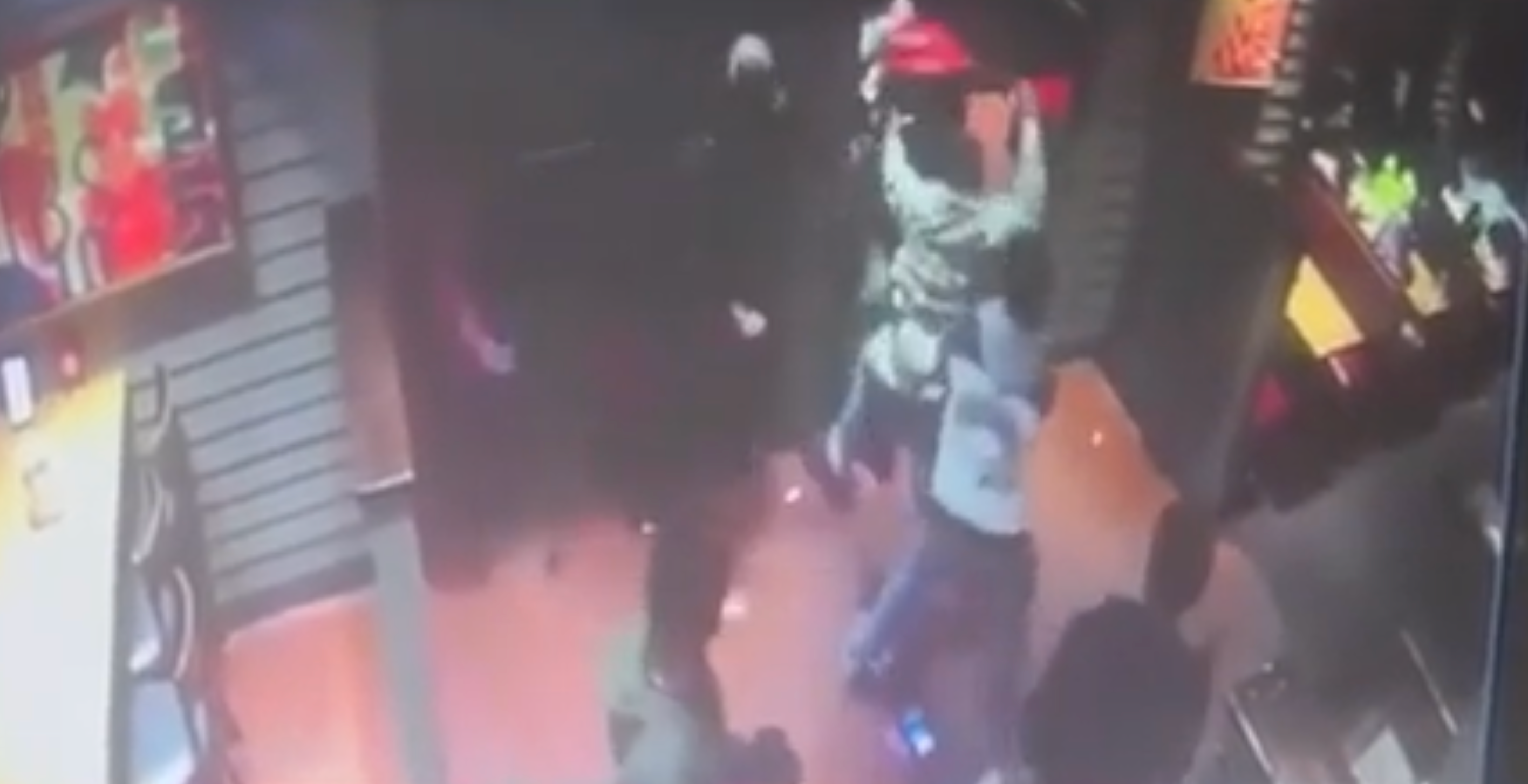 Footage shows the group kicking, punching and pulling on Drew’s hair inside the restaurant