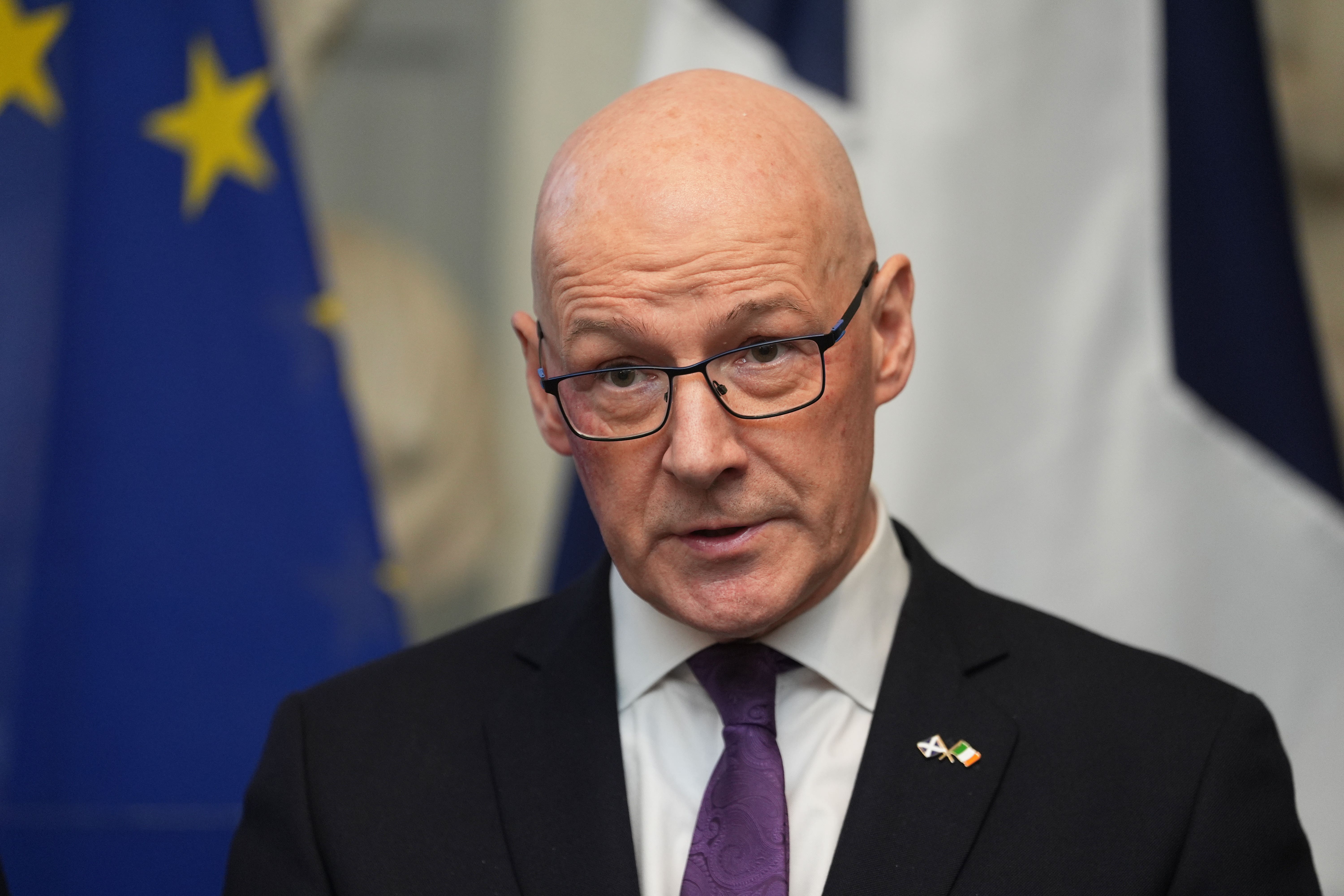 First Minister John Swinney said the Scottish Government would put more money into tackling child poverty (Brian Lawless/PA)