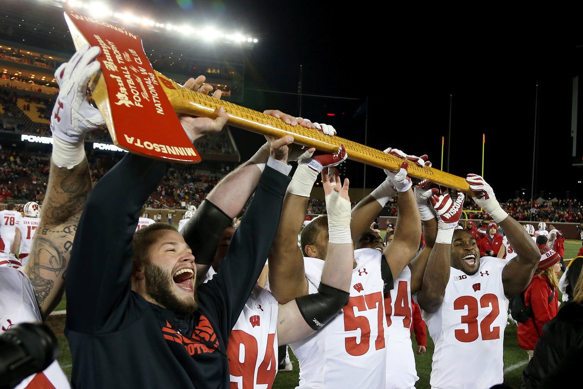 What do an axe, a bucket and a cannon have in common? Meet the rivalry trophies of college football