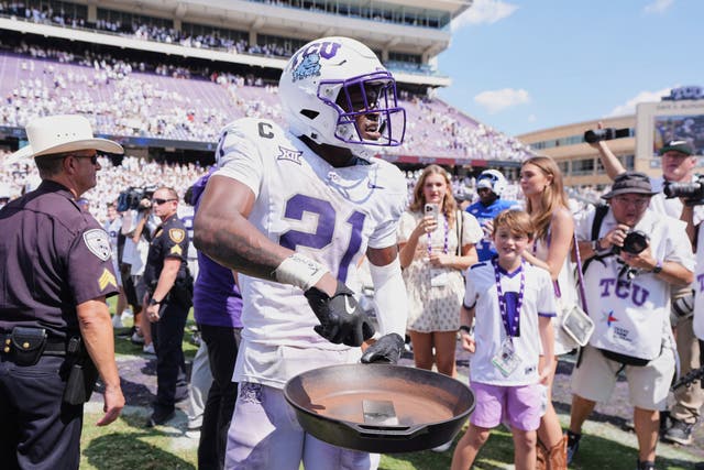 <p>TCU safety Bud Clark (21) celebrates with the "iron skillet" after the team's win over SMU in an NCAA college football game, Saturday, Sept. 20, 2025, in Fort Worth, Texas</p>