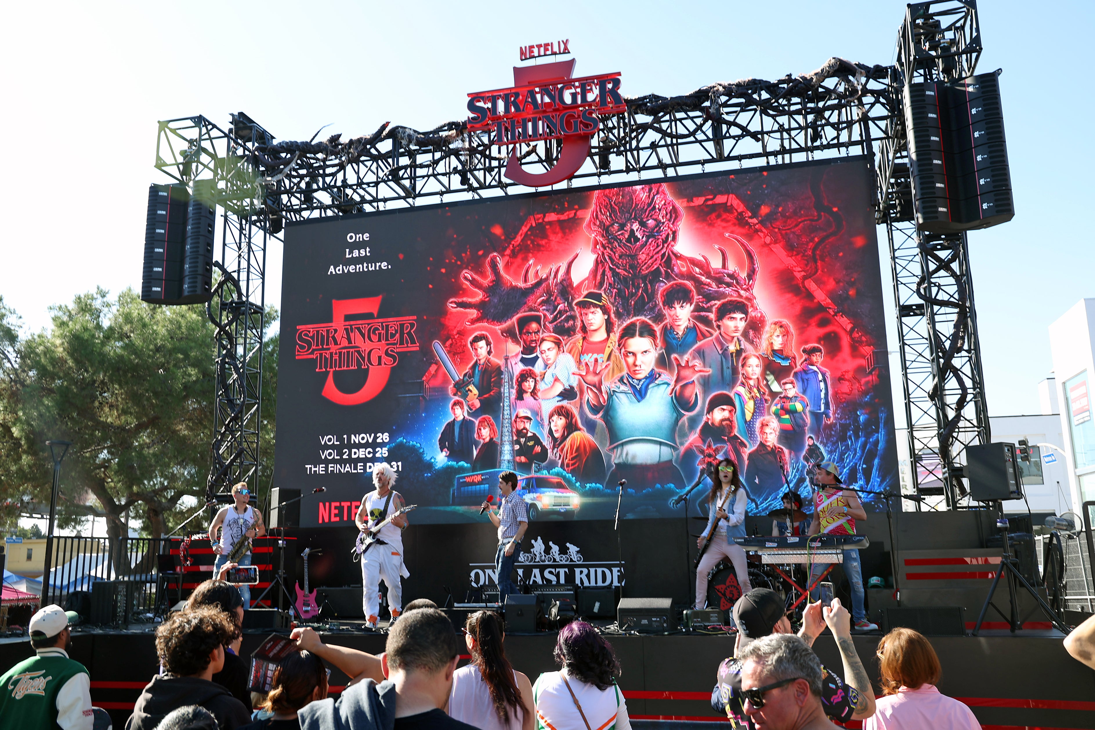 The Flux Capacitors perform onstage at the Stranger Things Bike Ride fan event