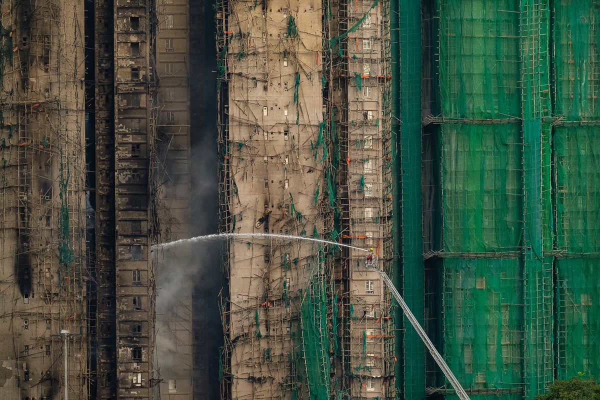 Fire that killed at least 44 burns in Hong Kong towers for a second day